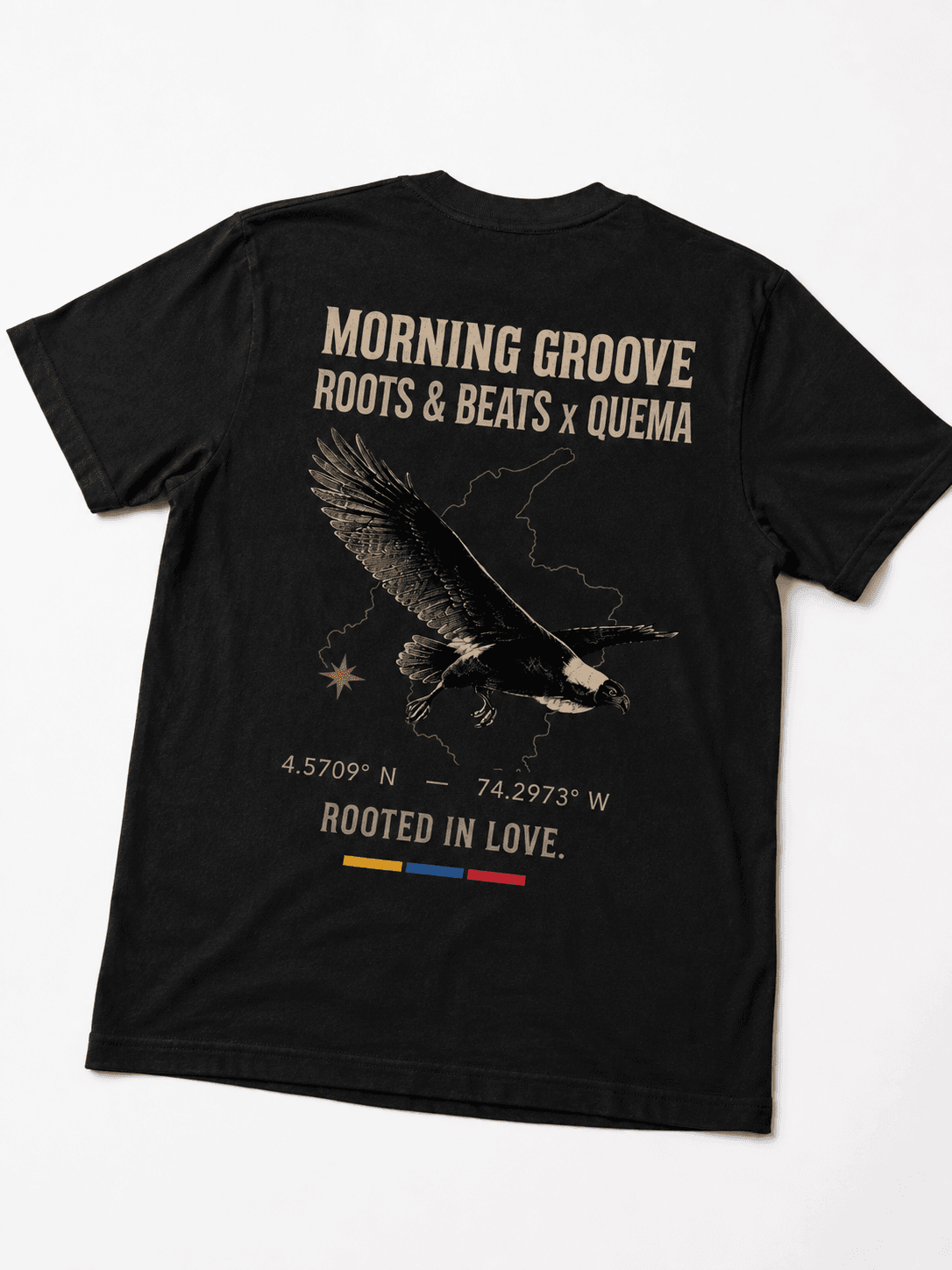 Black tee with a tan eagle over the outline of Colombia and the words Rooted In Love